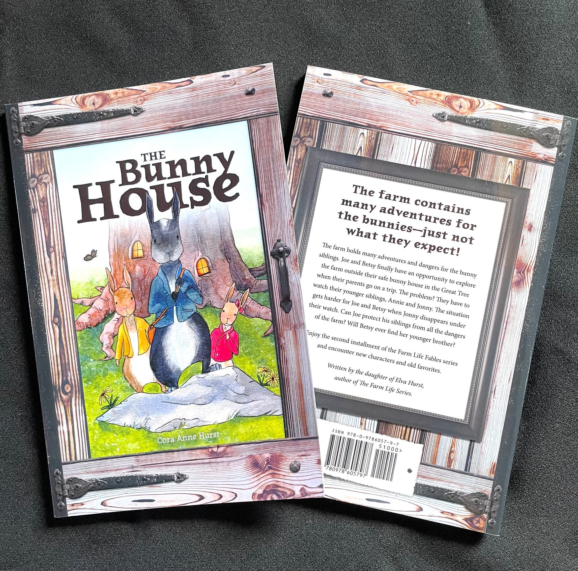 A book called the bunny house is sitting on a table