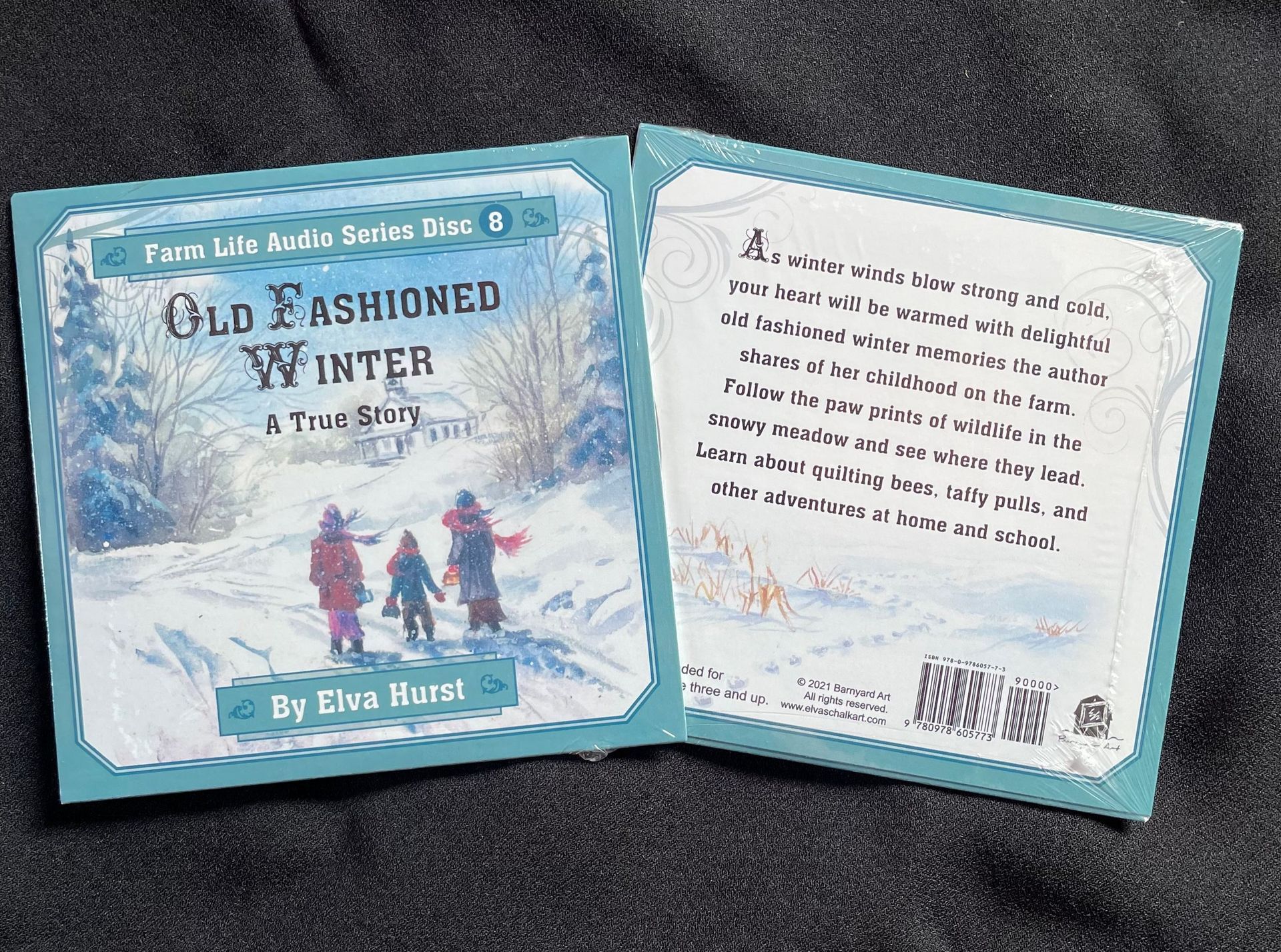 A book called old fashioned winter is sitting on a table.