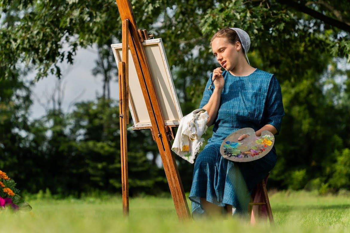 woman painting in nature