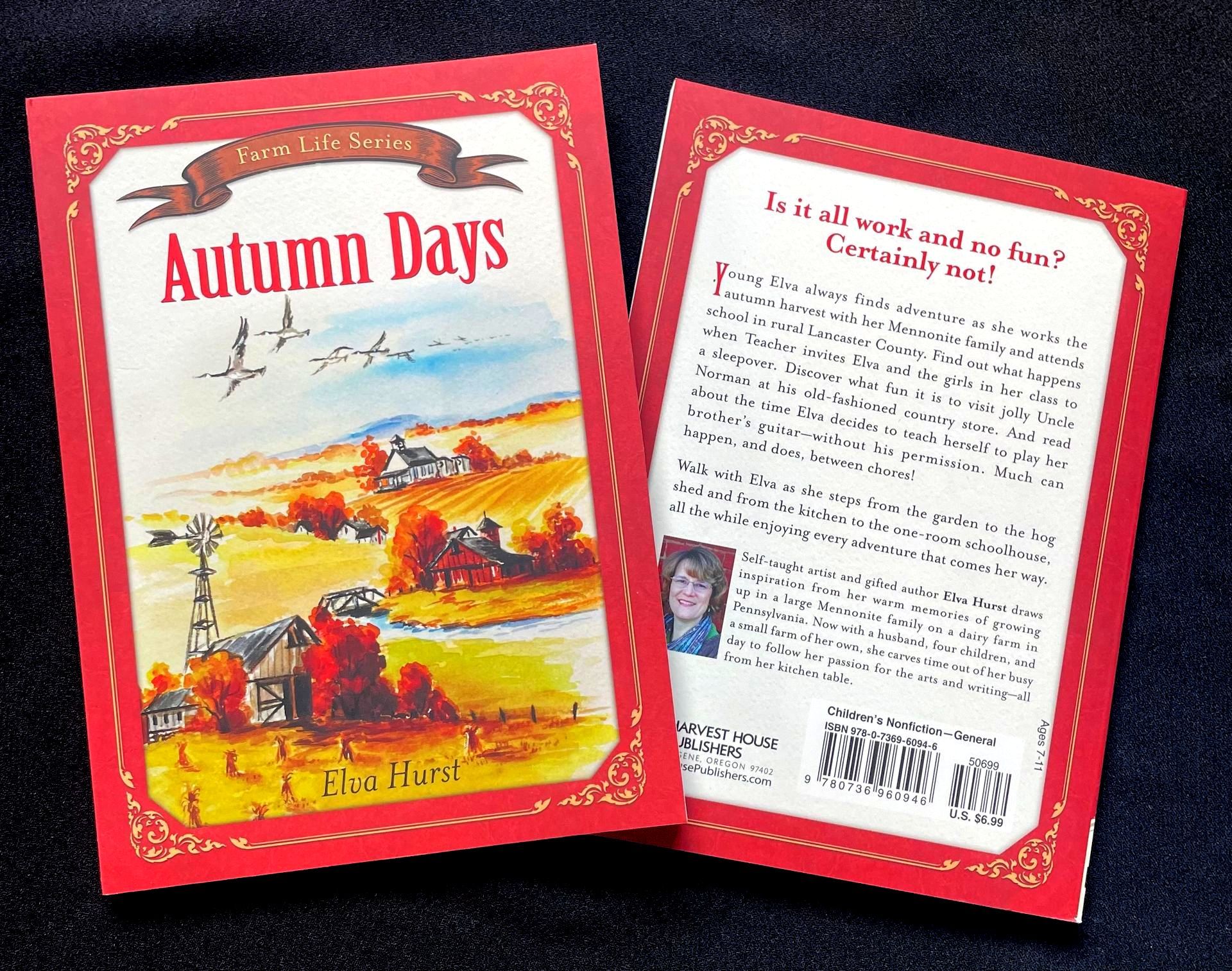 A book called autumn days sits on a table