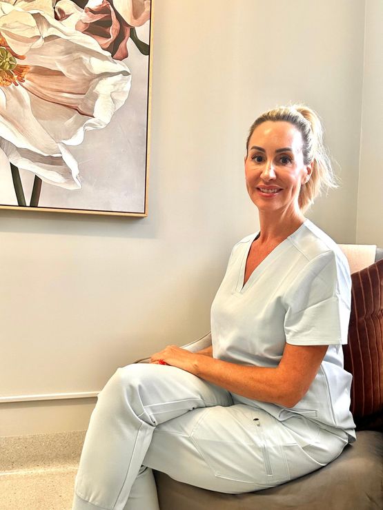 A Woman is Getting Her Eyebrows Trimmed With a Scalpel — Renew Laser Clinic in Taree, NSW