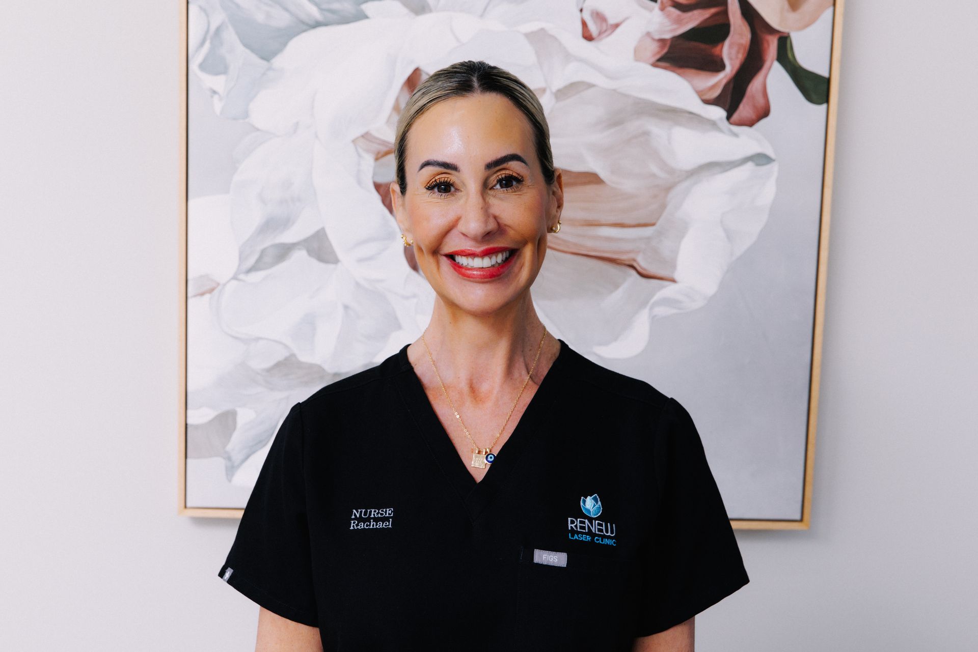 A Woman is Getting Her Eyebrows Trimmed With a Scalpel — Renew Laser Clinic in Taree, NSW
