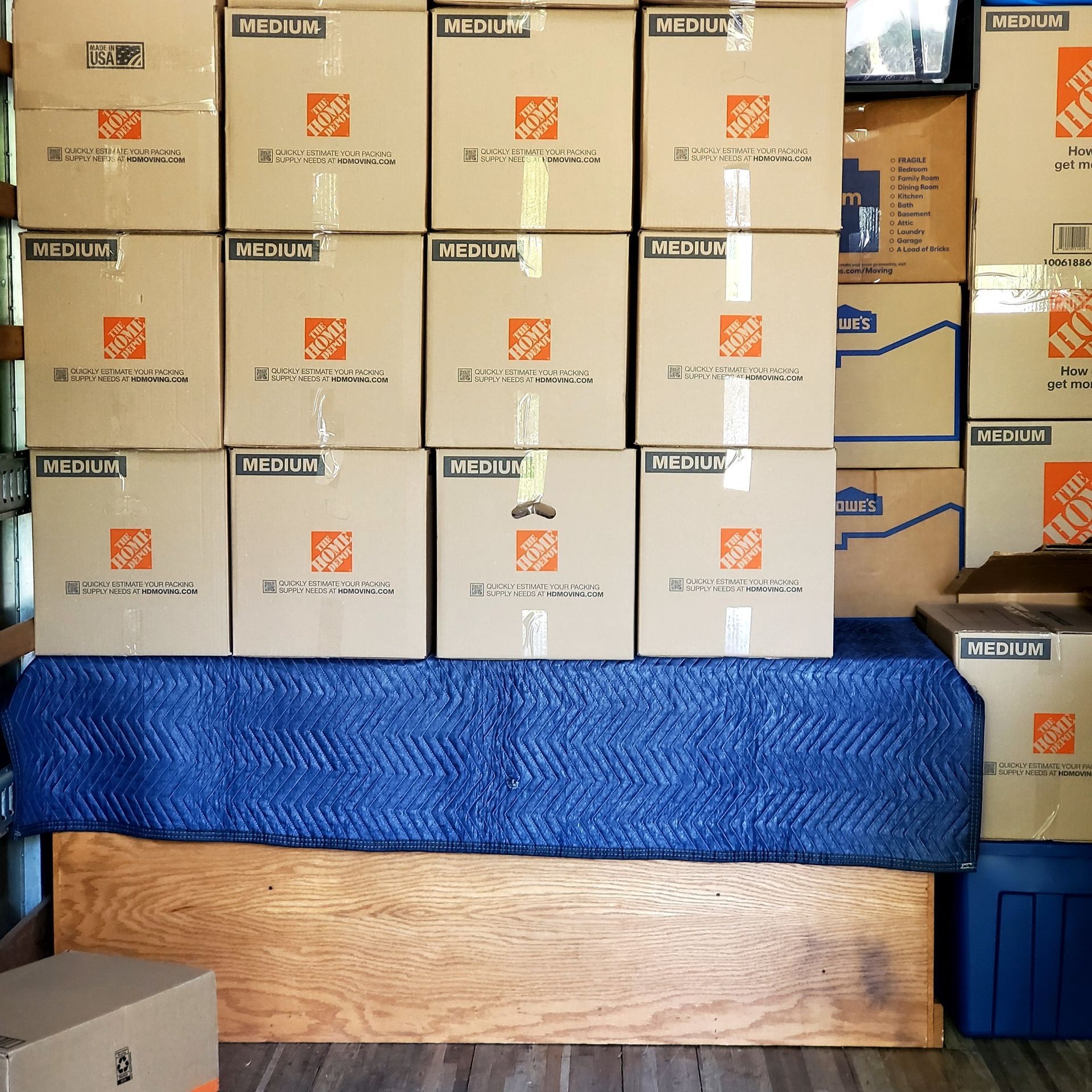 The home depot boxes are stacked on top of each other