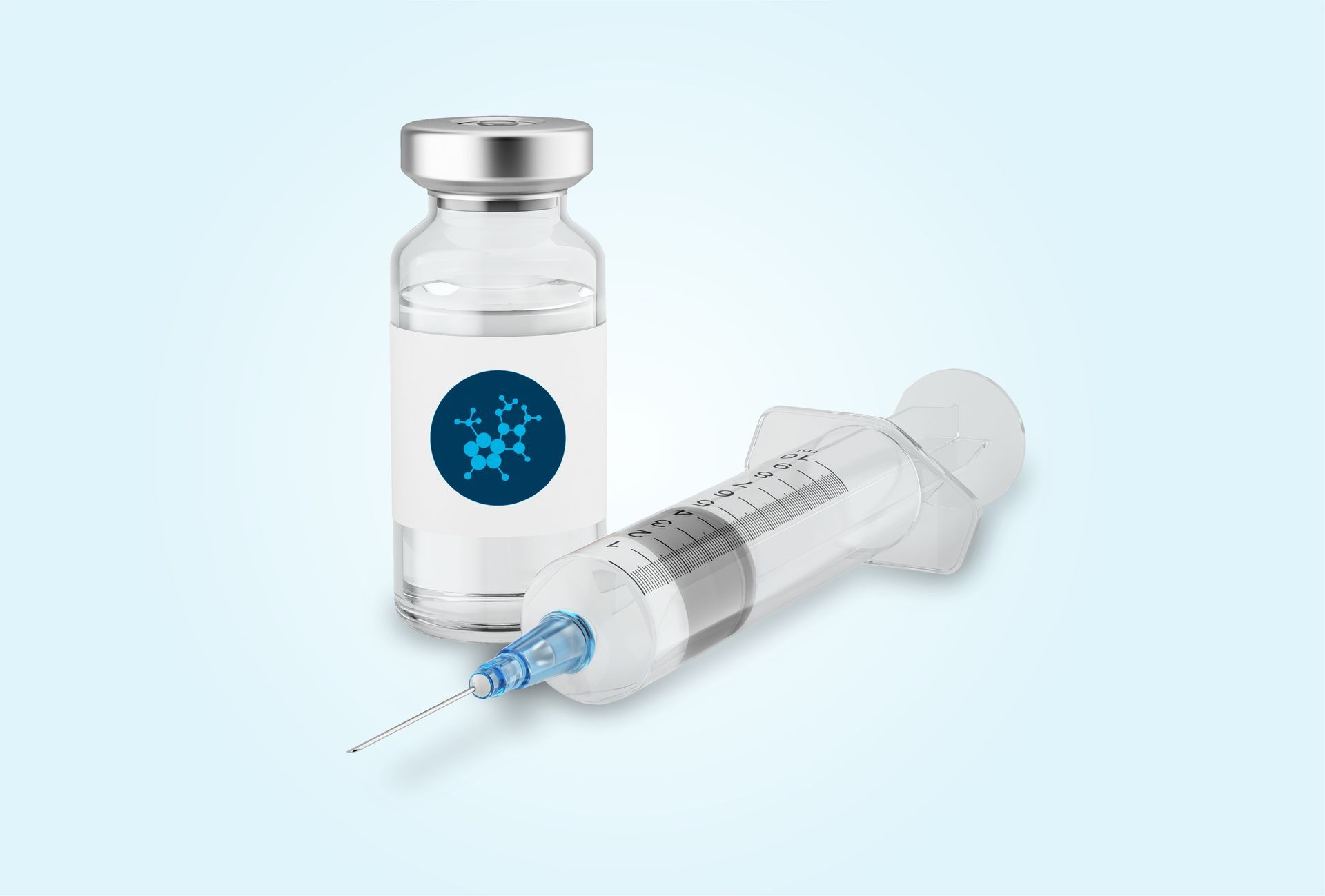 Photo of a glass vile filled with liquid positioned next to a syringe.