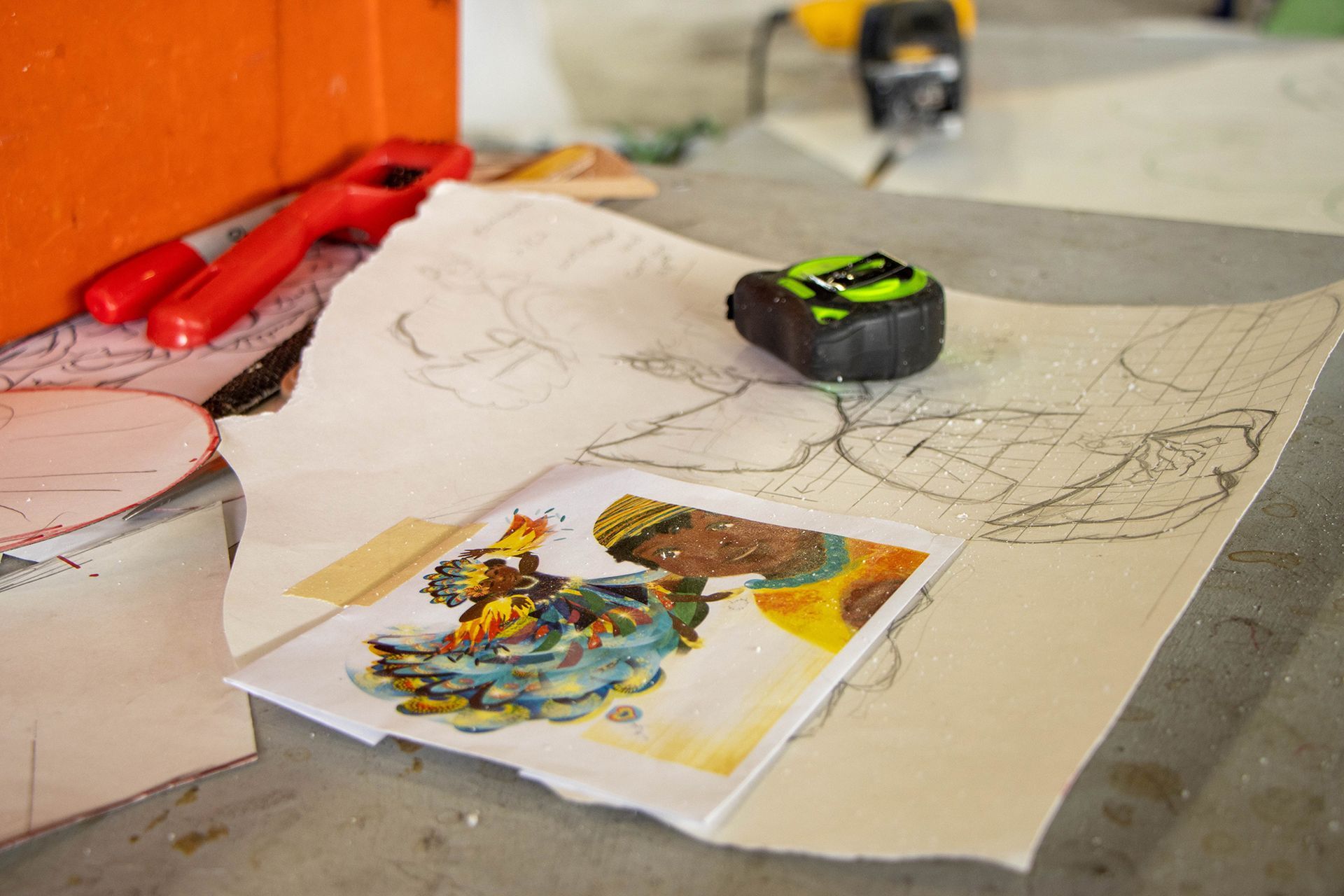 A tape measure is sitting on top of a piece of paper on a table.