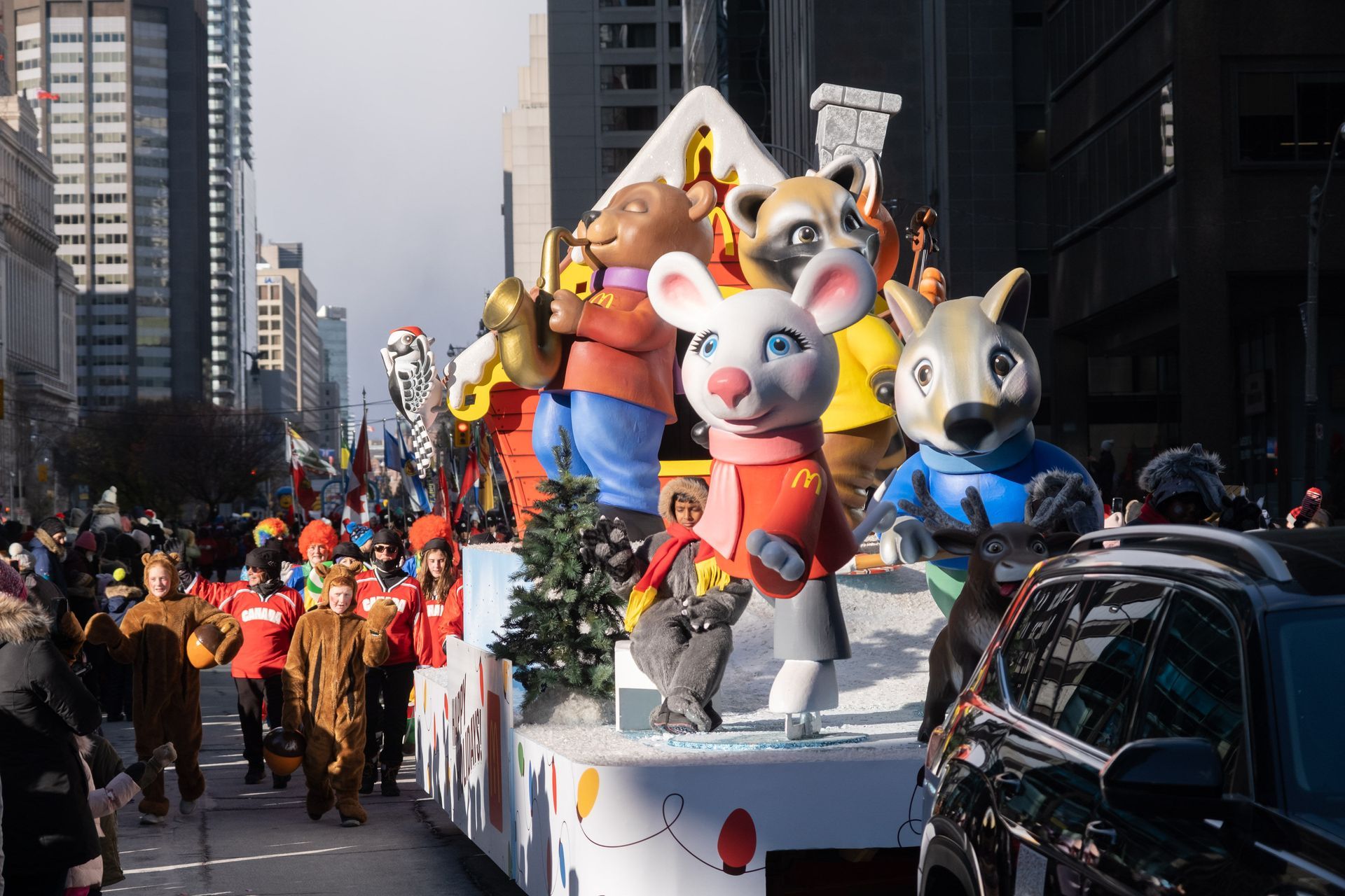 A parade with a bunch of stuffed animals on floats