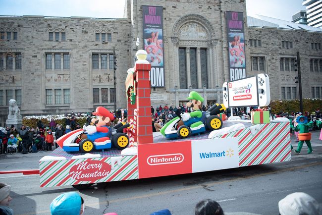 A parade with mario and luigi on a float