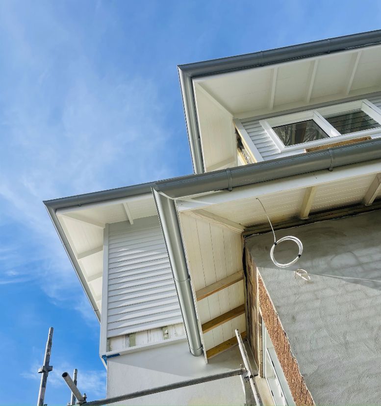 A House Under Construction With a Blue Sky in the Background — Platinum Pride Roofing In Wyoming, NSW
