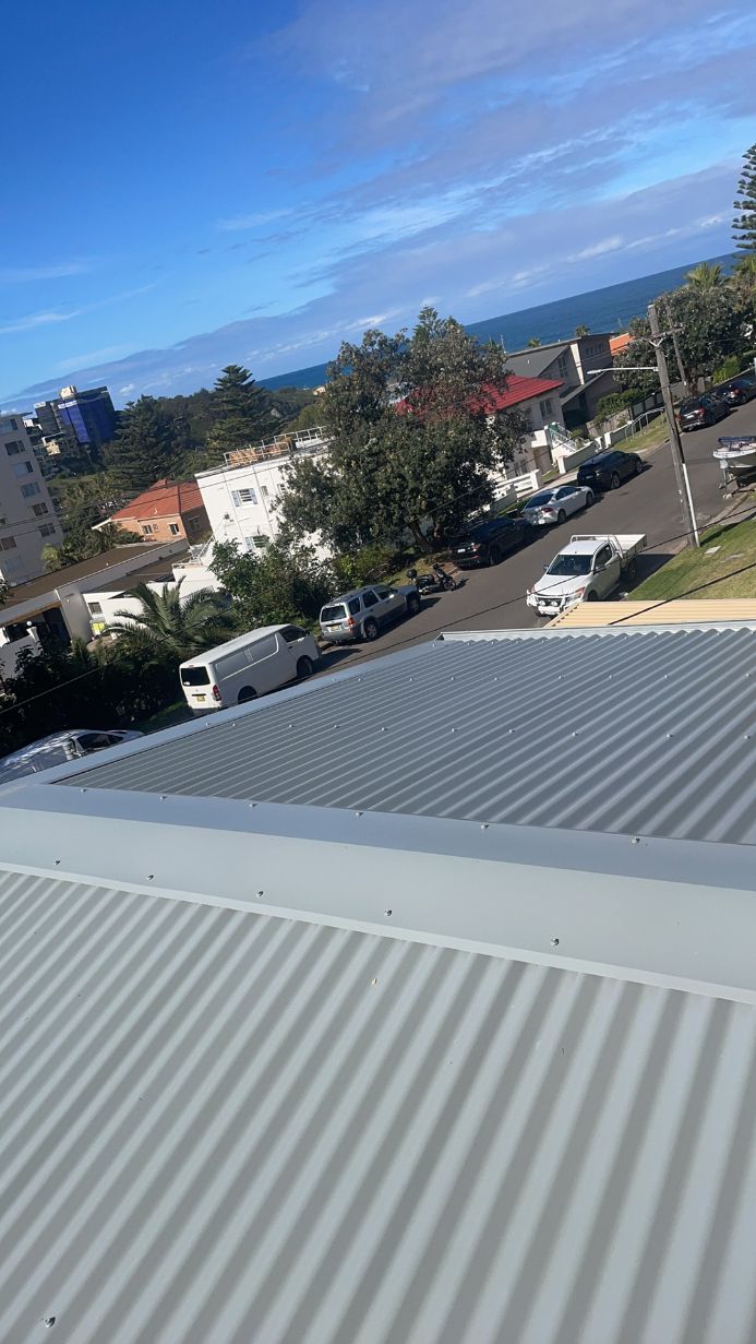 The Roof of a Building With a View of the Ocean — Platinum Pride Roofing In Woy Woy, NSW