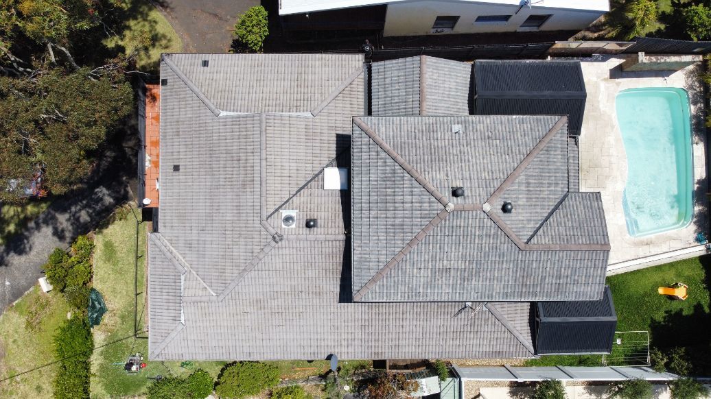 An Aerial View of a Large House With a Pool in the Backyard — Platinum Pride Roofing In Wyong, NSW