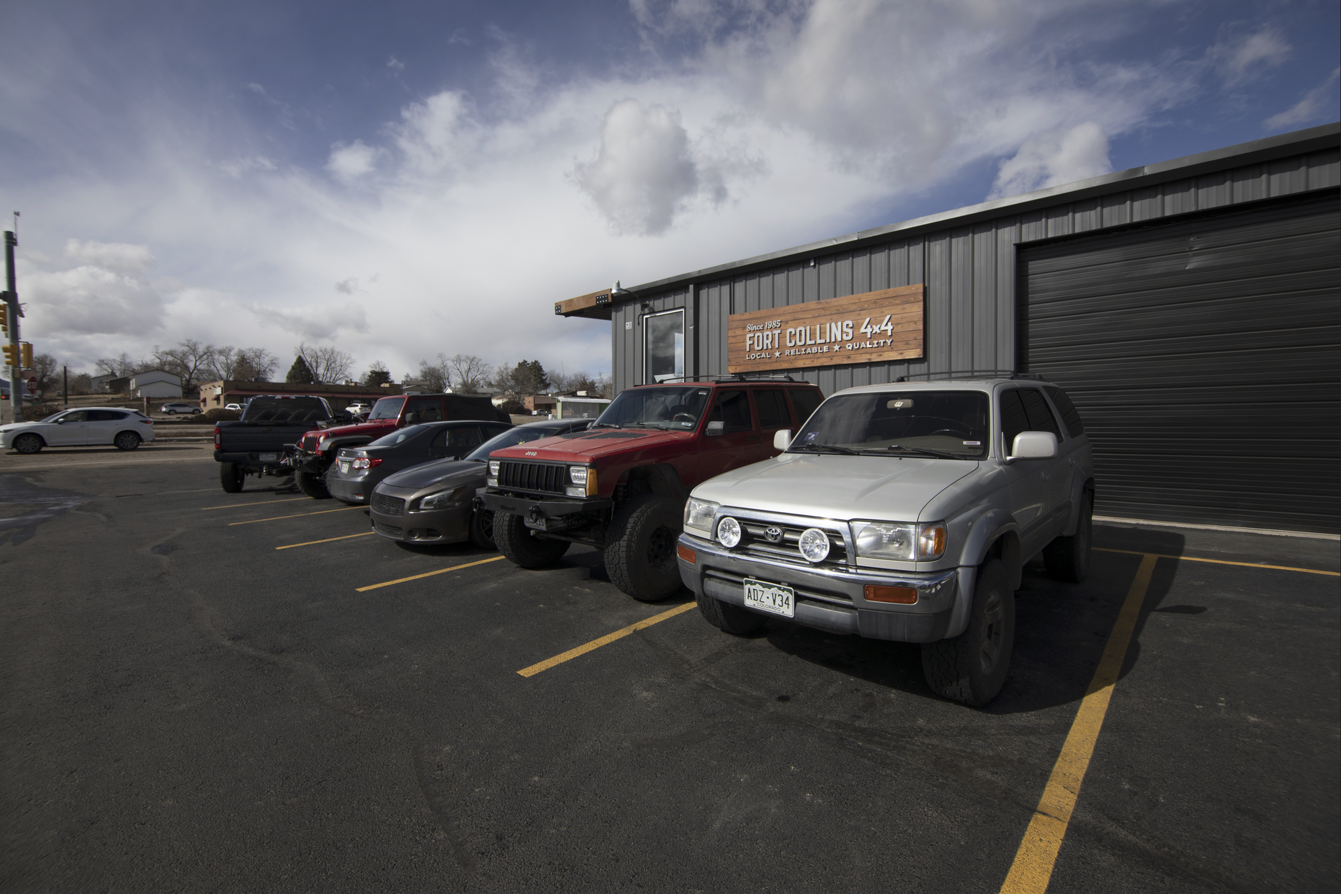 Gray building with a garage | Fort Collins 4x4