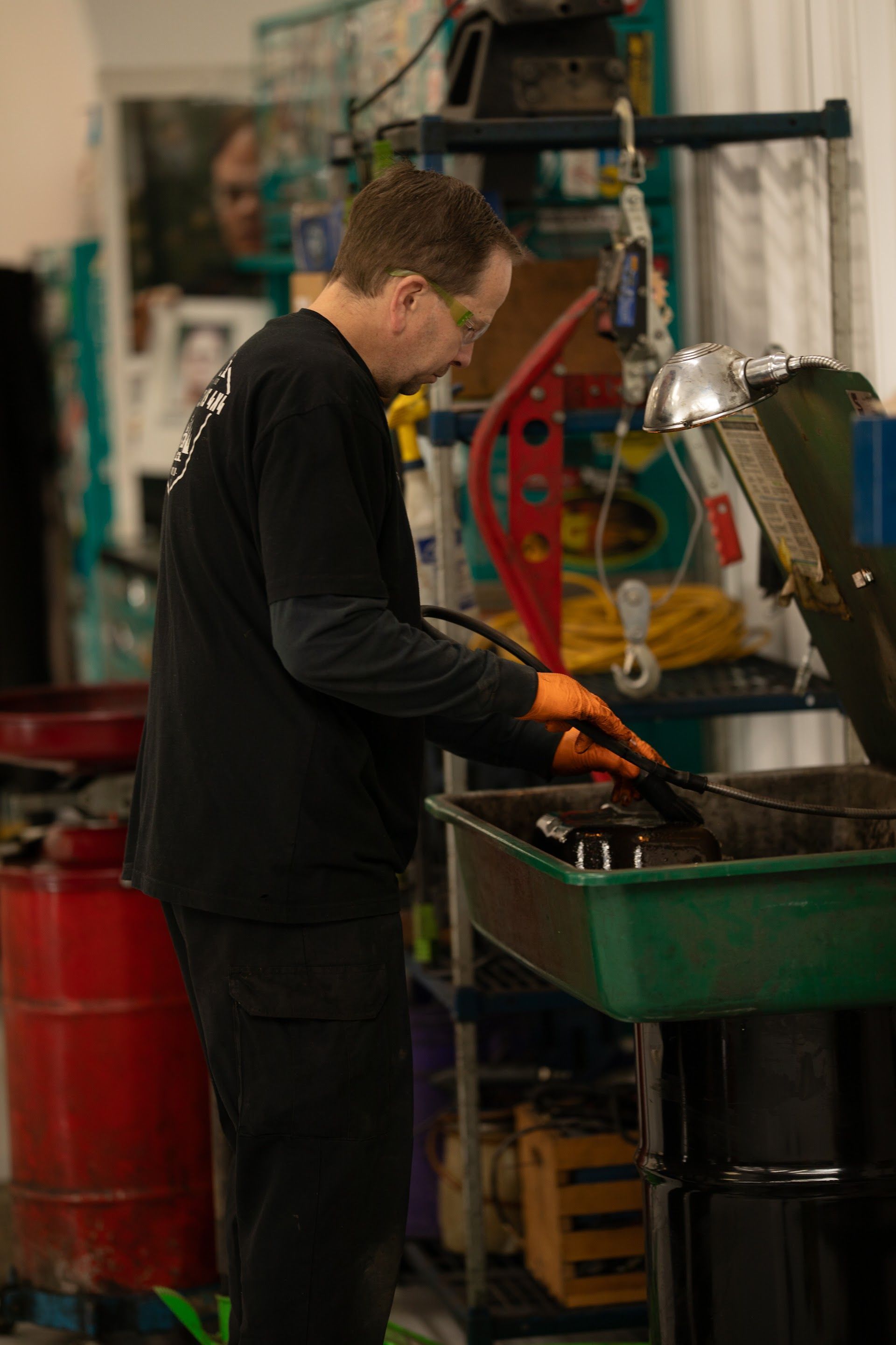 Mechanic in a shop, wearing safety glasses and gloves | Fort Collins 4x4