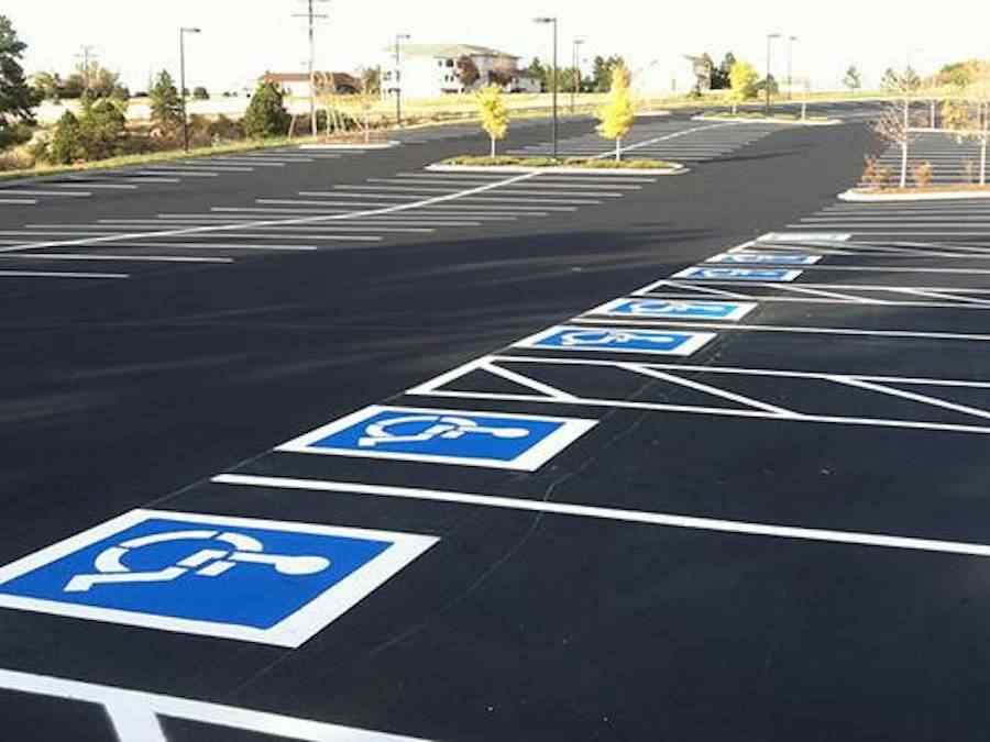 A parking lot with handicap signs painted on it