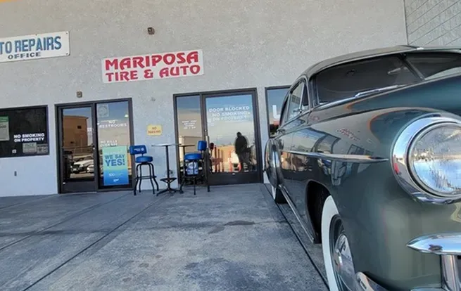 Classic car parked in front of our parking lot in Hesperia, CA | Mariposa Tire & Auto
