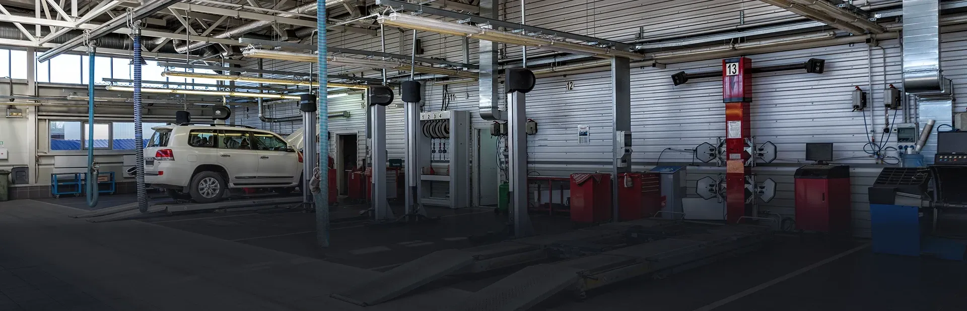 White vehicle in garage in Hesperia, CA | Mariposa Tire & Auto