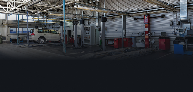 White vehicle in garage in Hesperia, CA | Mariposa Tire & Auto