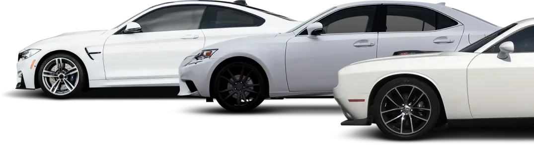 Three white cars parked | Mariposa Tire & Auto