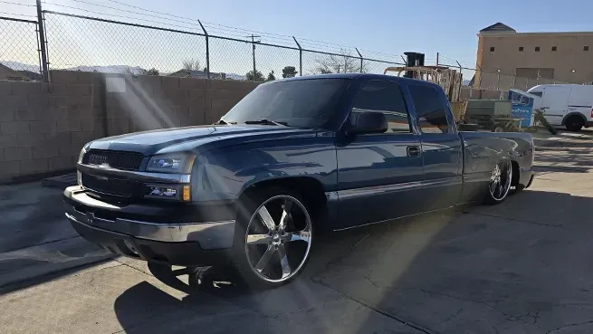 Black truck parked outside | Mariposa Tire & Auto