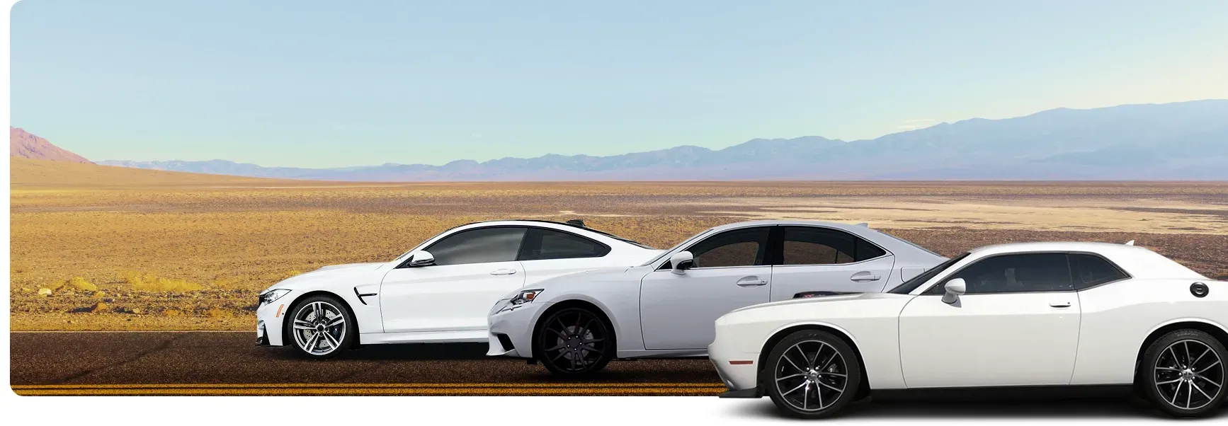 Three White Vehicles Parked Outside | Mariposa Tire & Auto