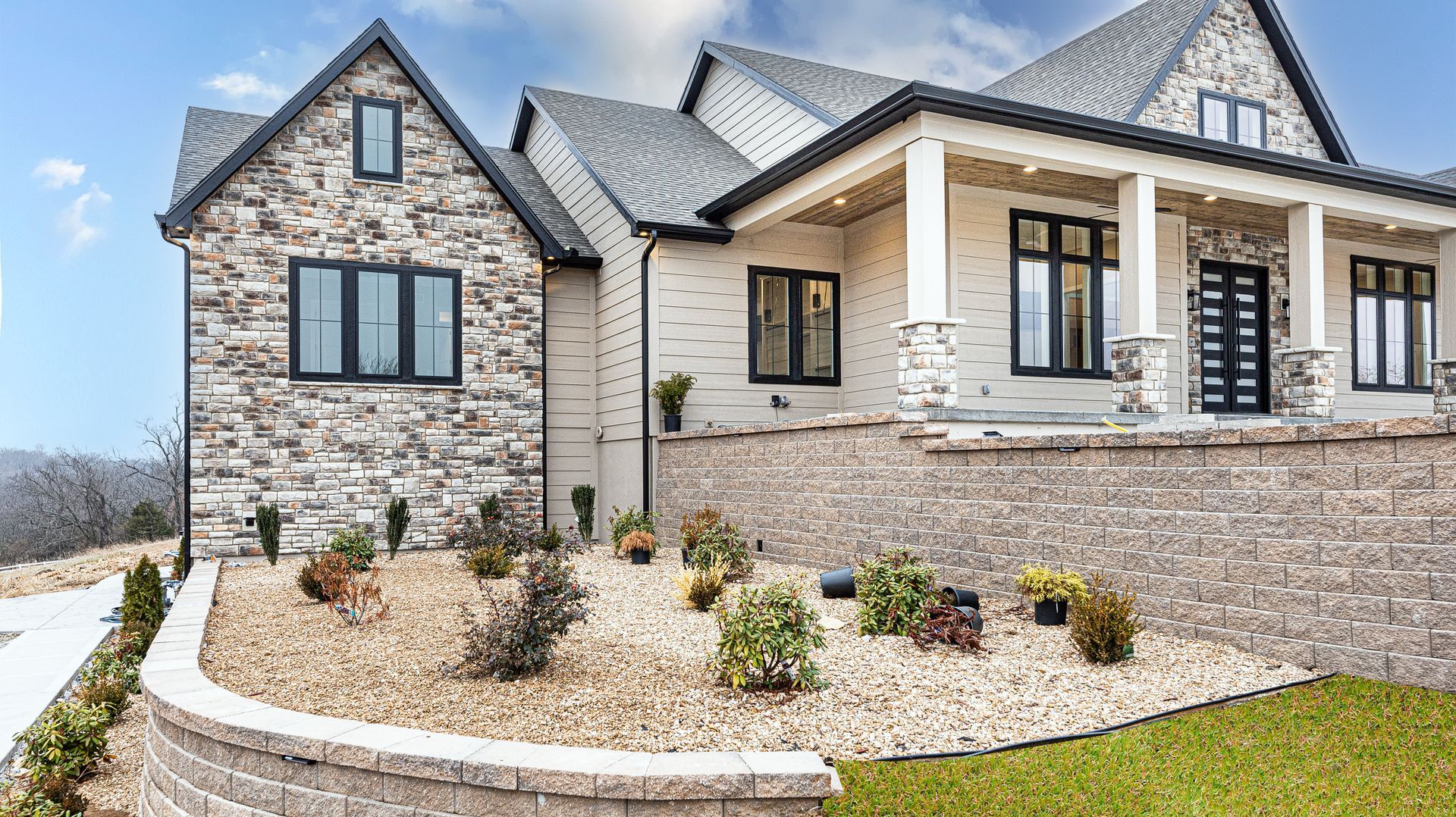 A large house is sitting on top of a hill.