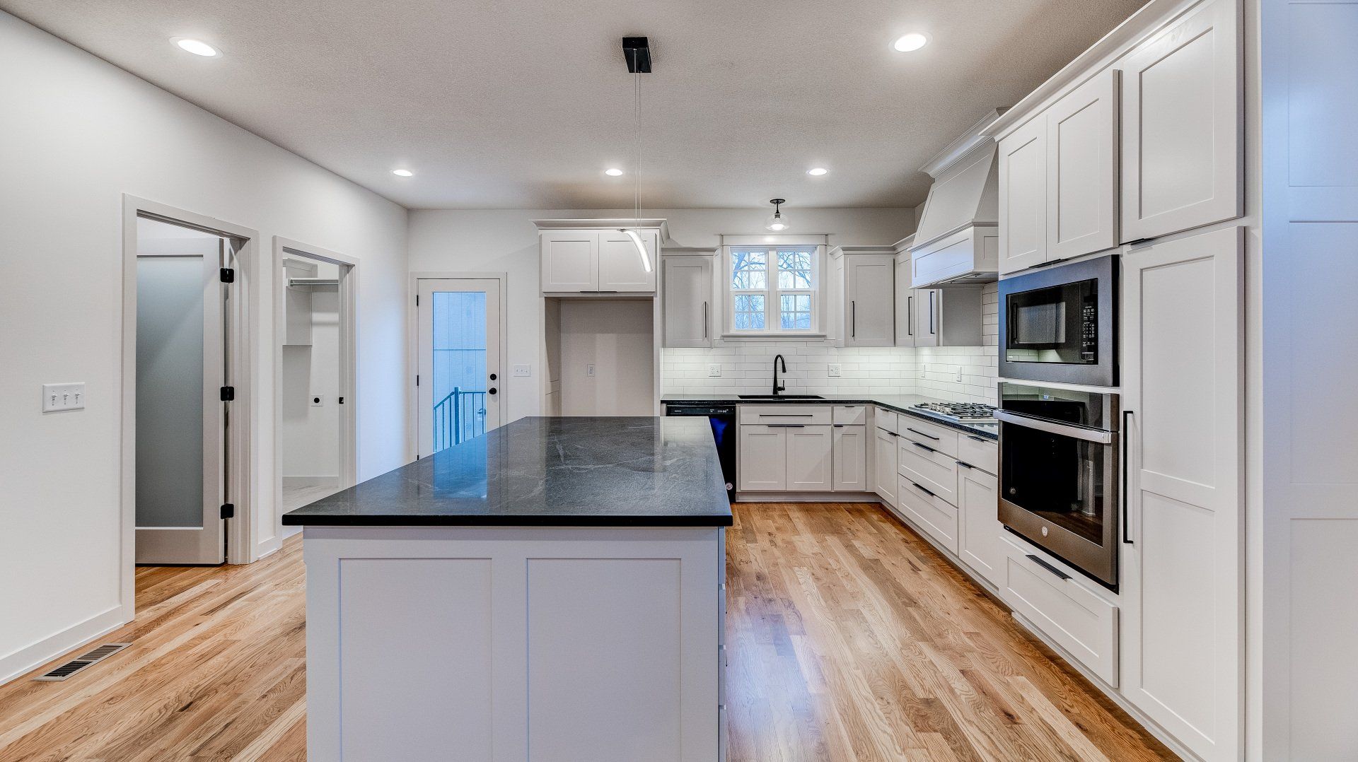 There is a large island in the middle of the kitchen.