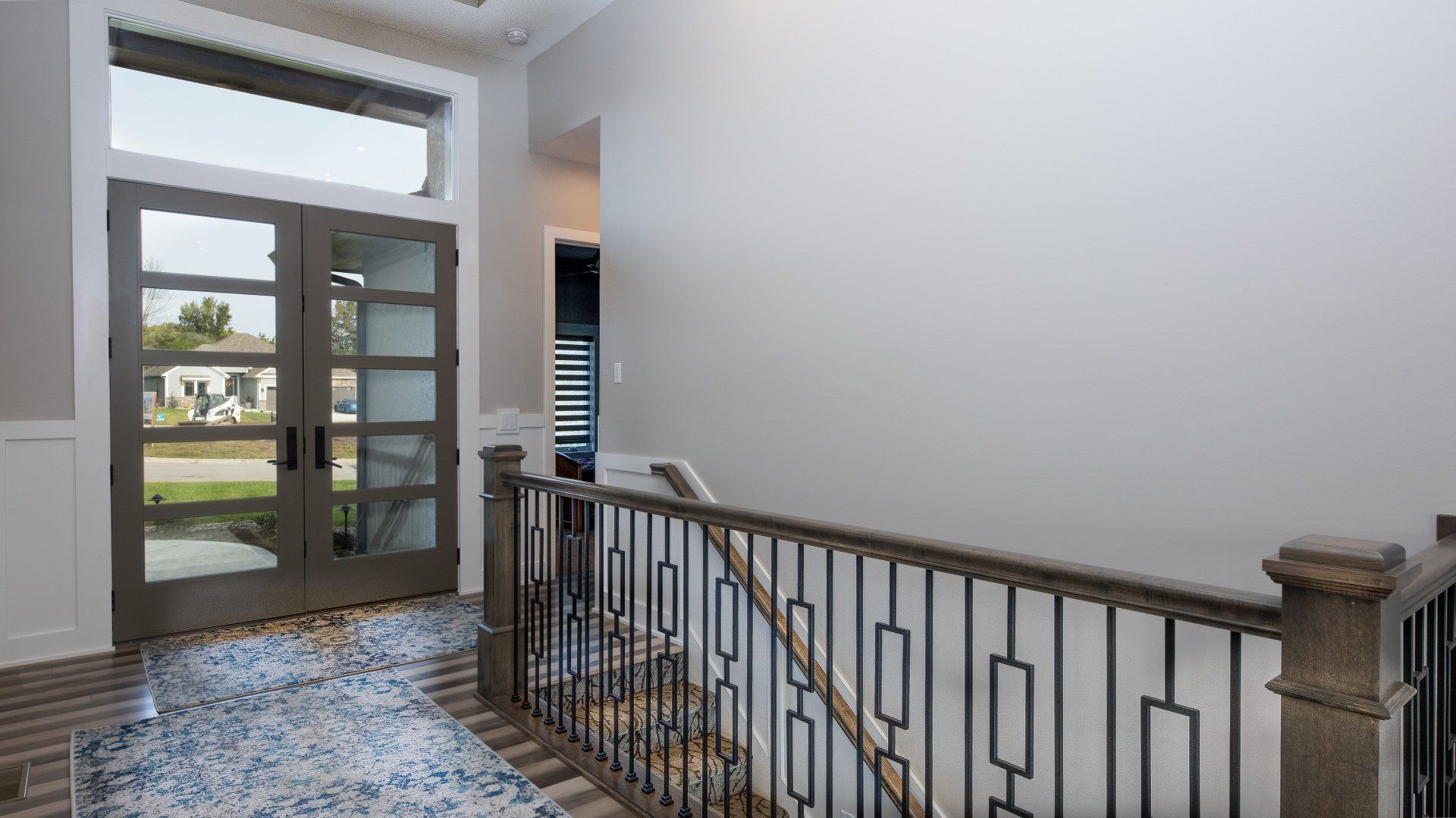 There is a staircase leading up to the second floor of a house.