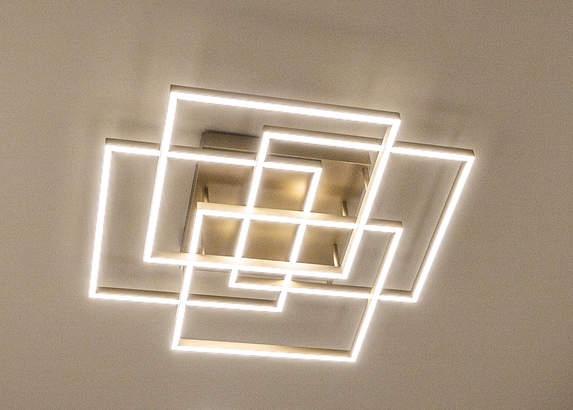 A ceiling light with a geometric design on it
