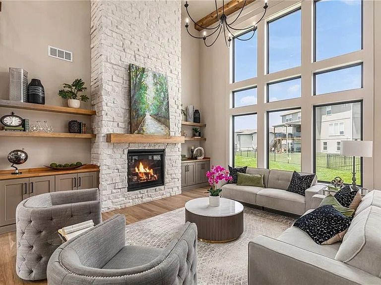 There is a fireplace in the middle of the living room.