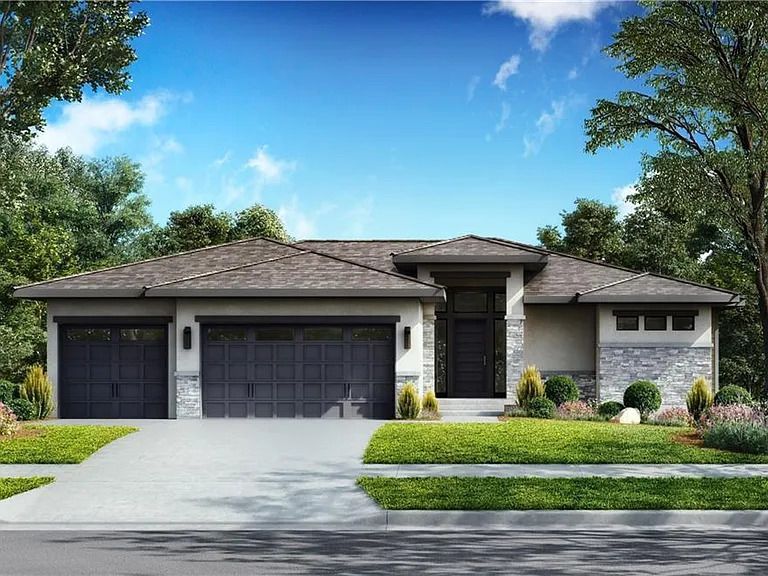 a house with two garages and a driveway.