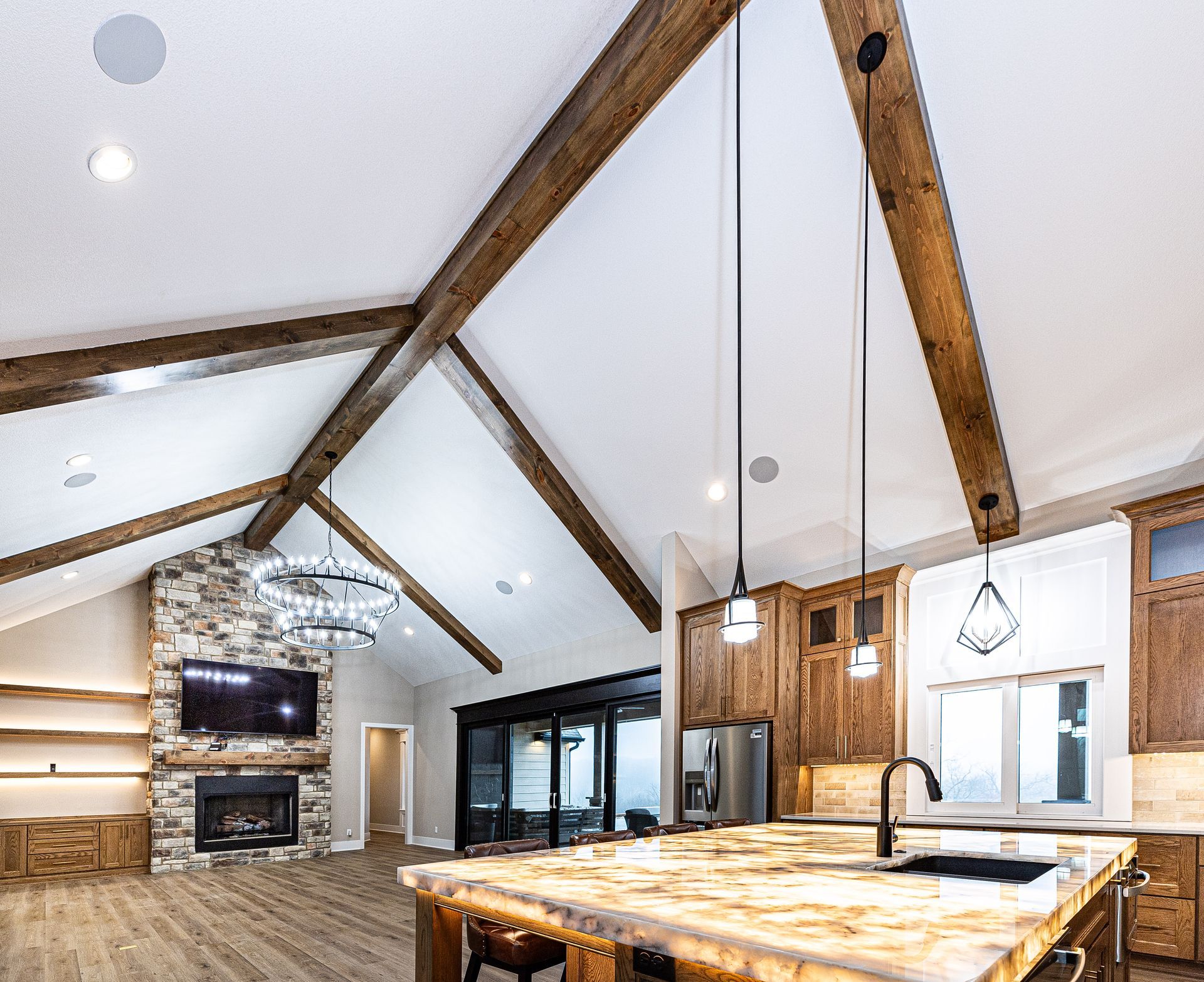 A kitchen with a large island and a fireplace