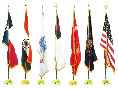 Seven flags of different colors, designs, and shapes displayed on golden stands.