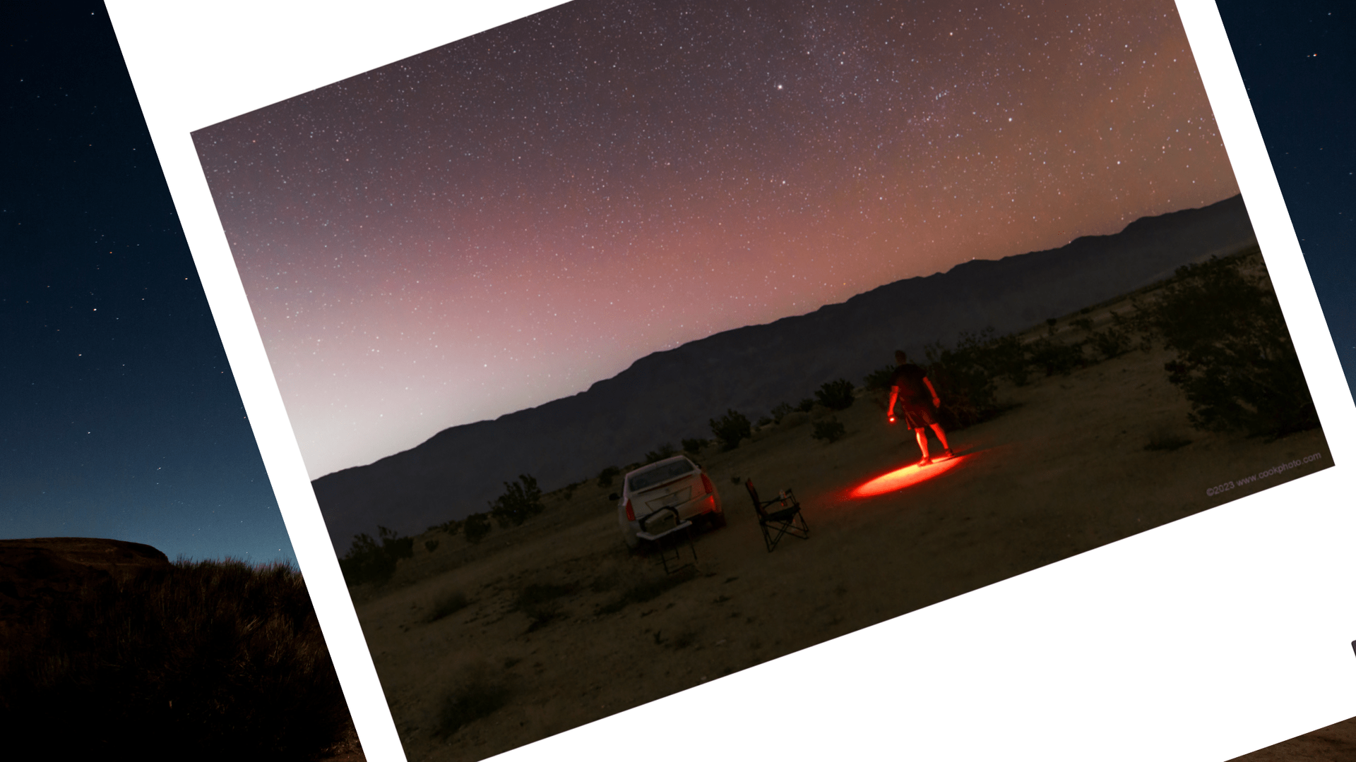 A picture of a person standing in the desert at night