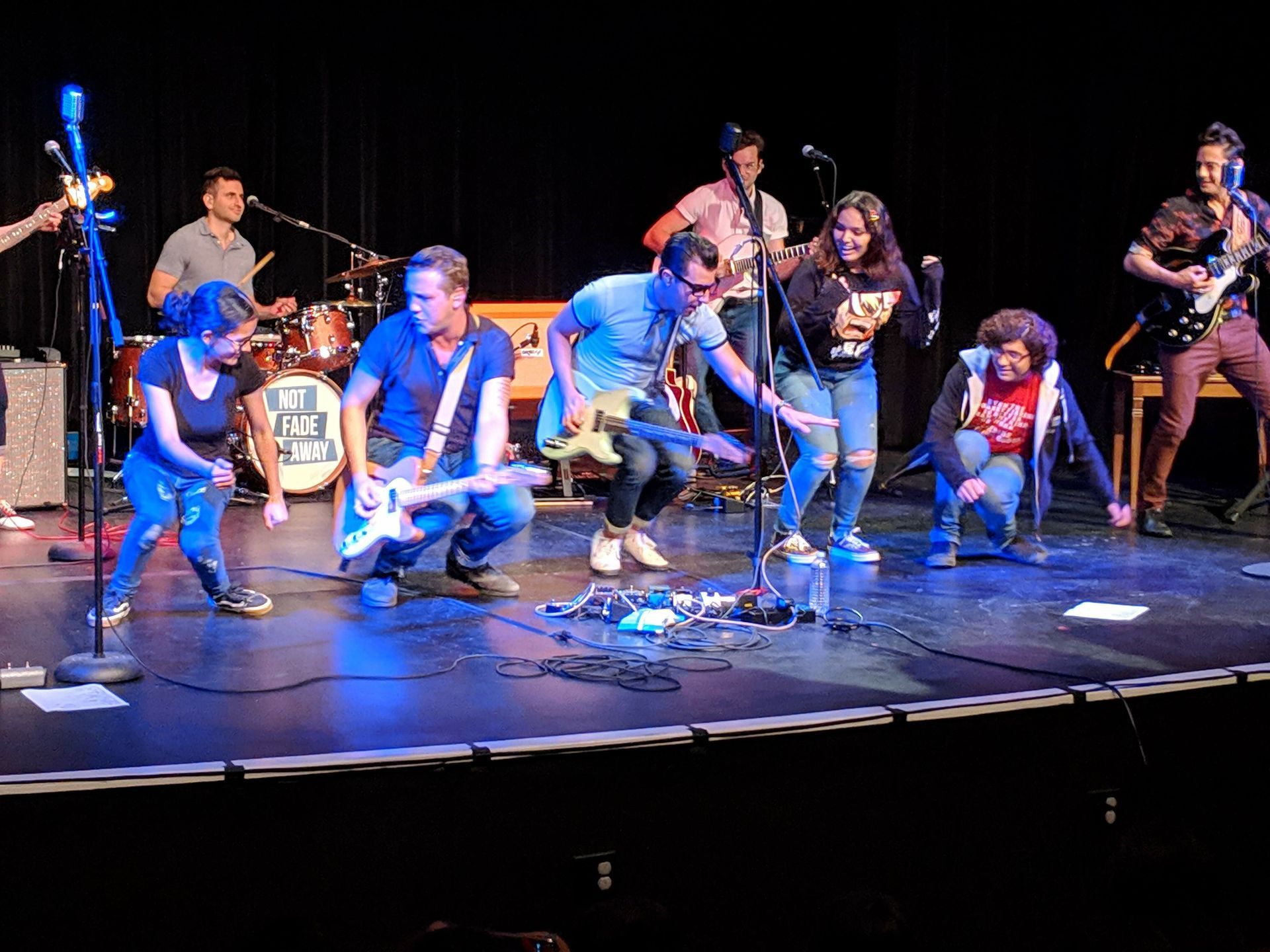 Kids at concert dancing 