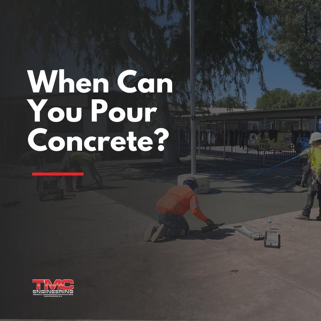 When can you pour concrete ? a man is kneeling down to pour concrete on a sidewalk.