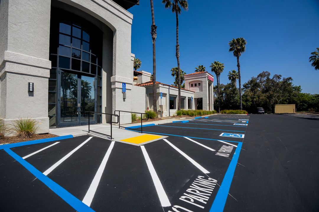 A handicapped parking spot in front of a building