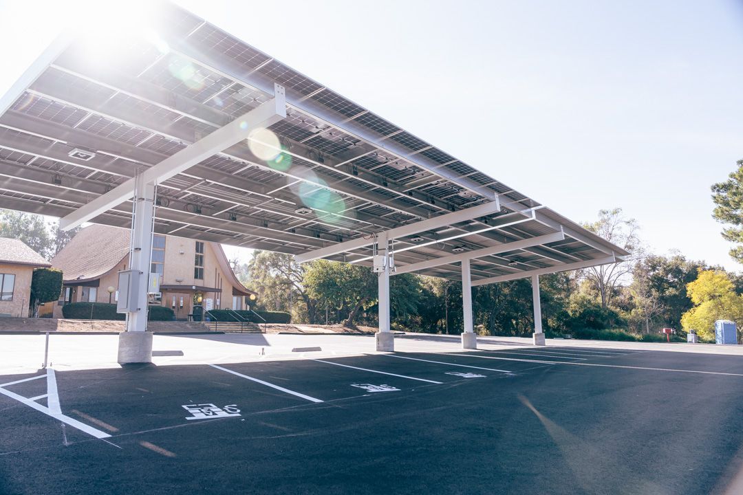 A parking lot with a canopy made of solar panels.