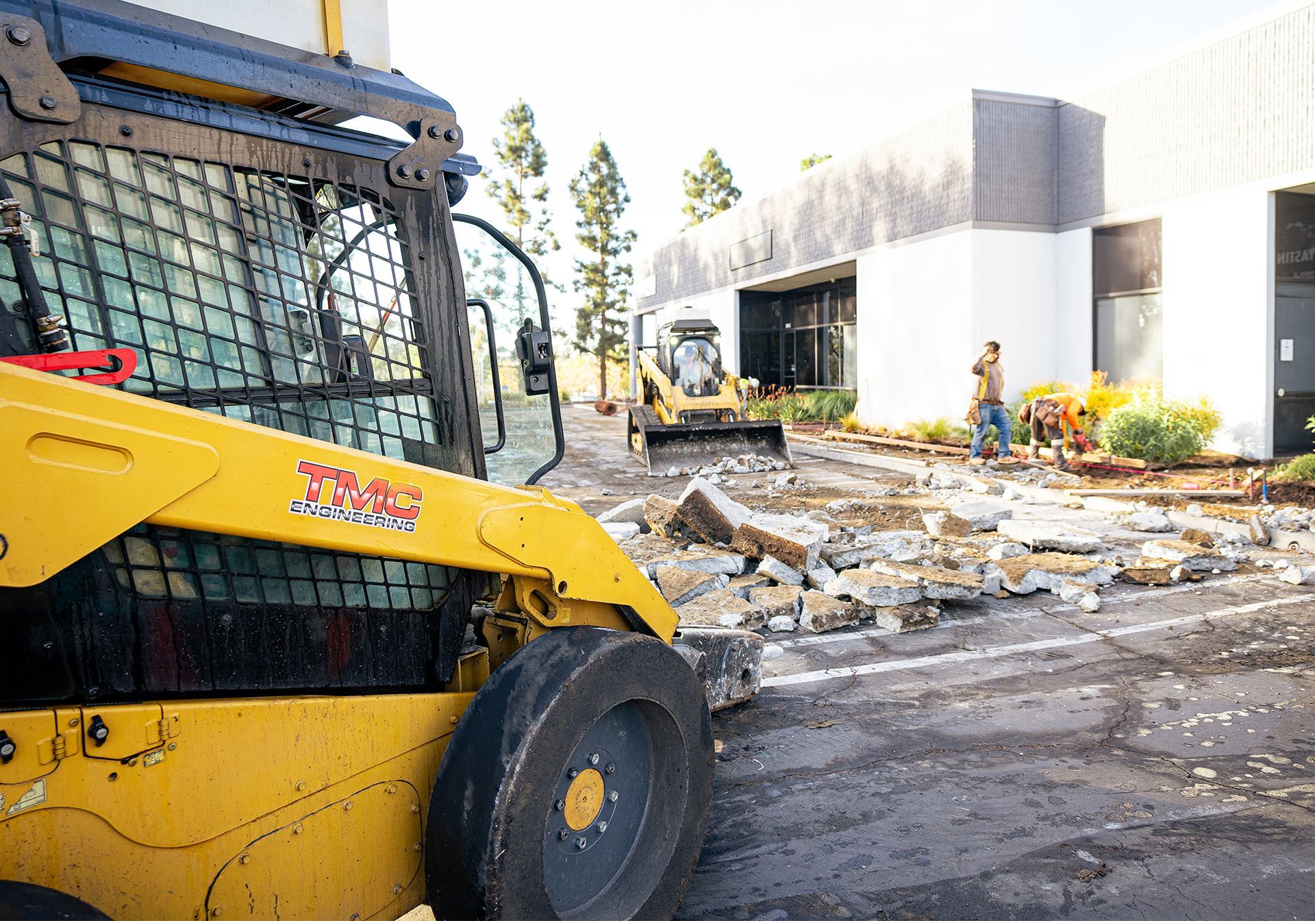 A yellow bulldozer is being used to demolish a building.