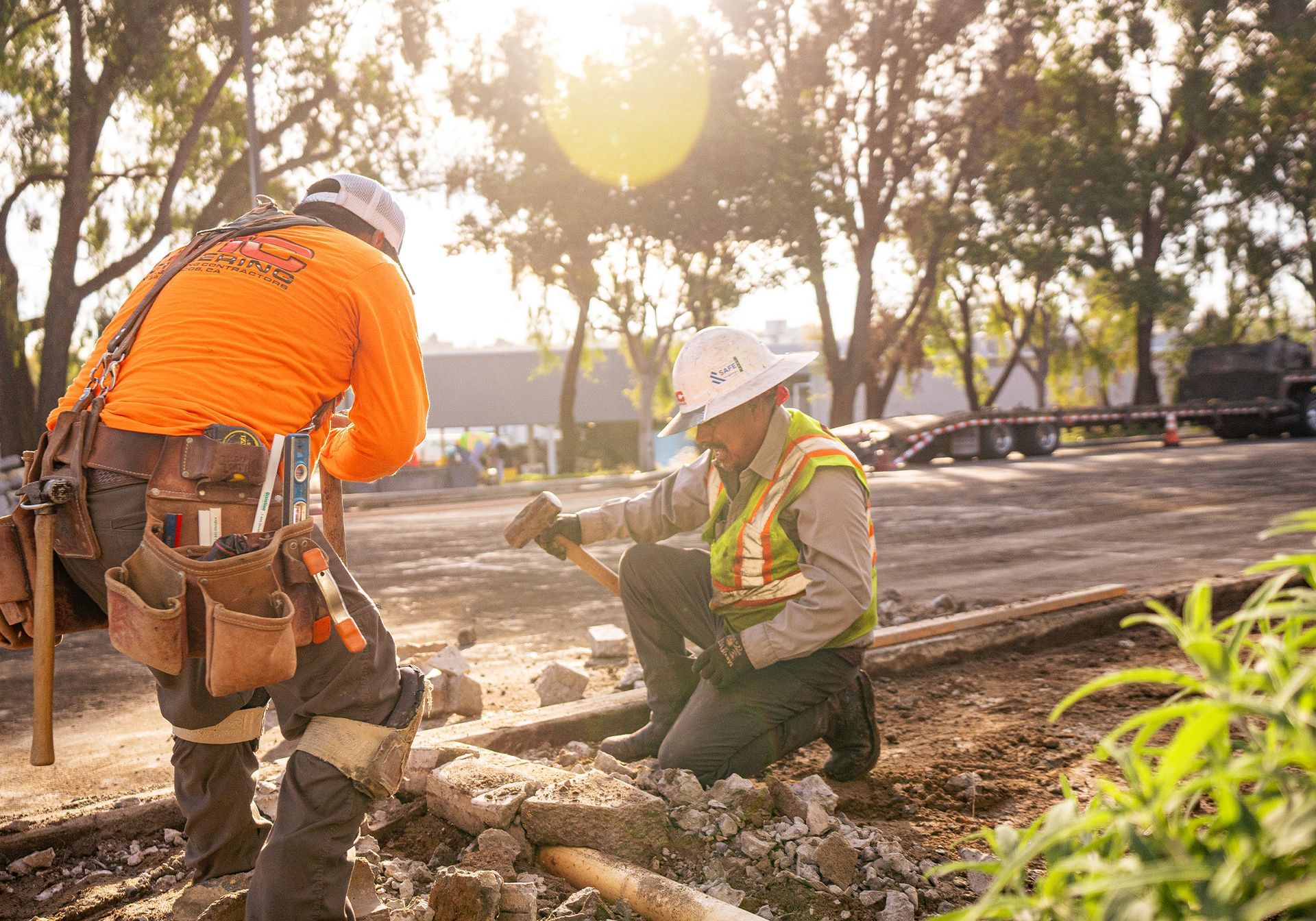 Two construction workers are working on a construction site.