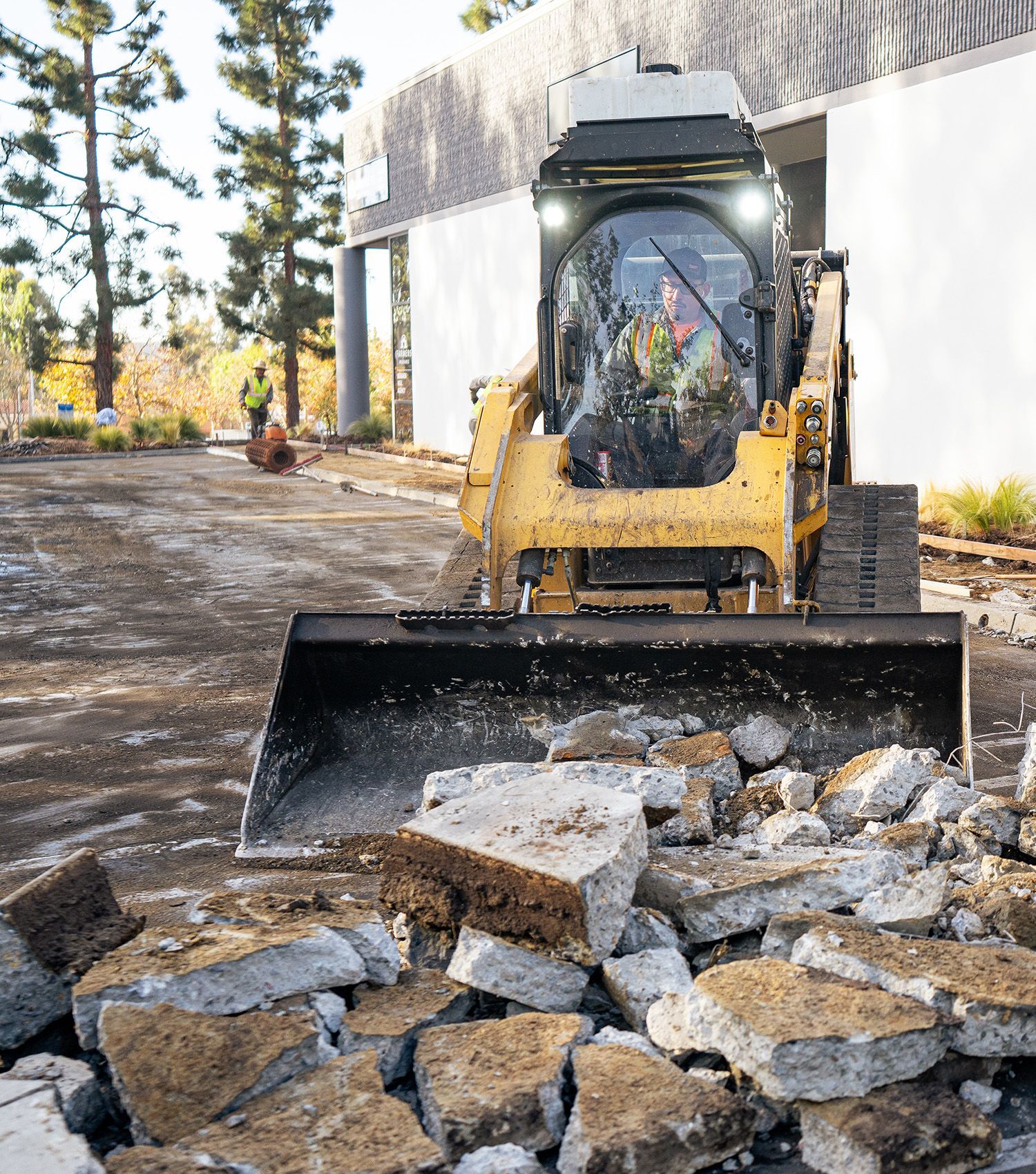 A bulldozer is moving rocks on a construction site.