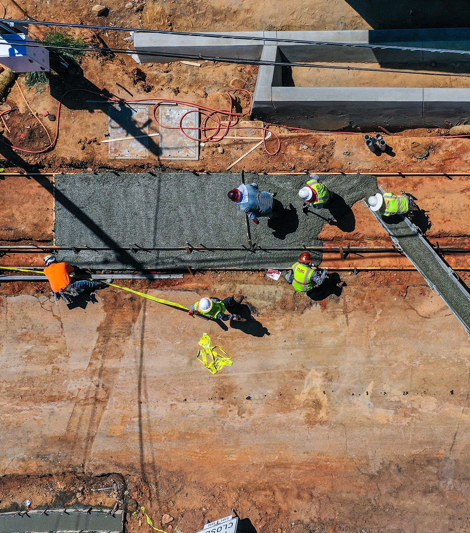 A group of construction workers are working on a construction site.