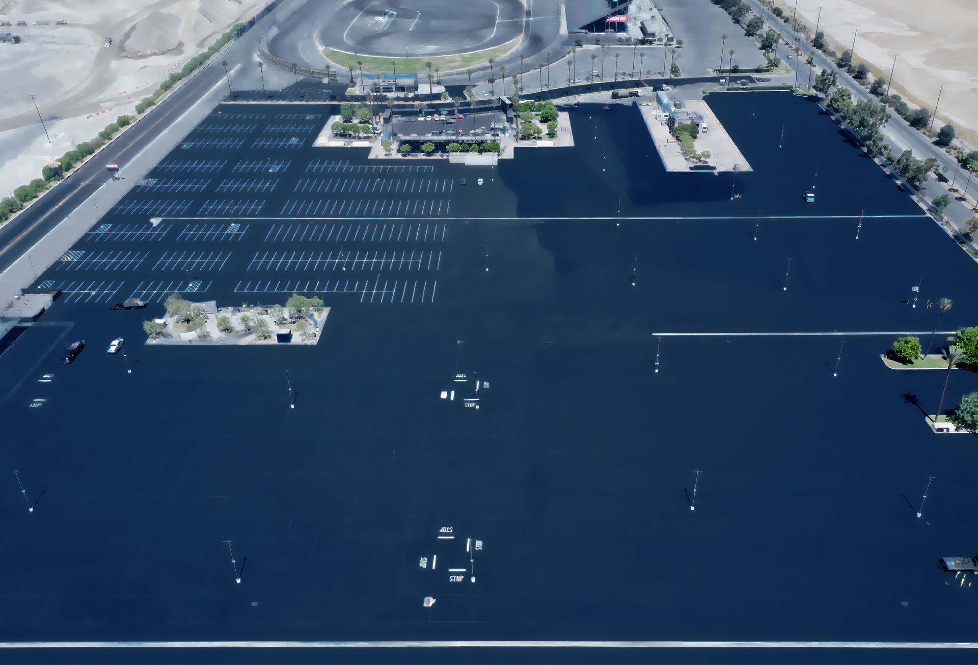 An aerial view of a parking lot with a lot of cars parked in it