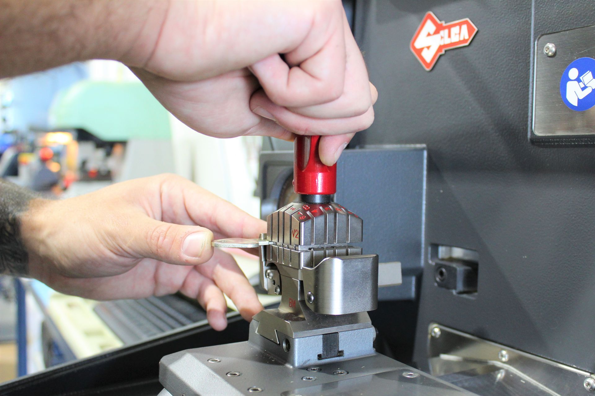 Restricted Key Being Cut  — Commercial Locksmiths on the Sunshine Coast, QLD