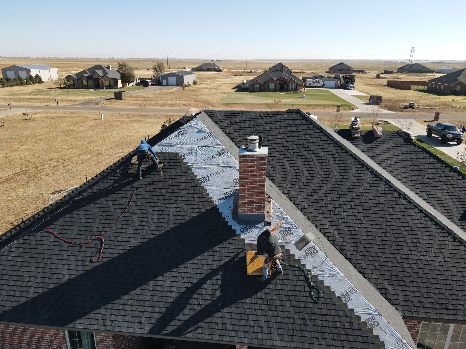 an aerial view of a house with a chimney on the roof .