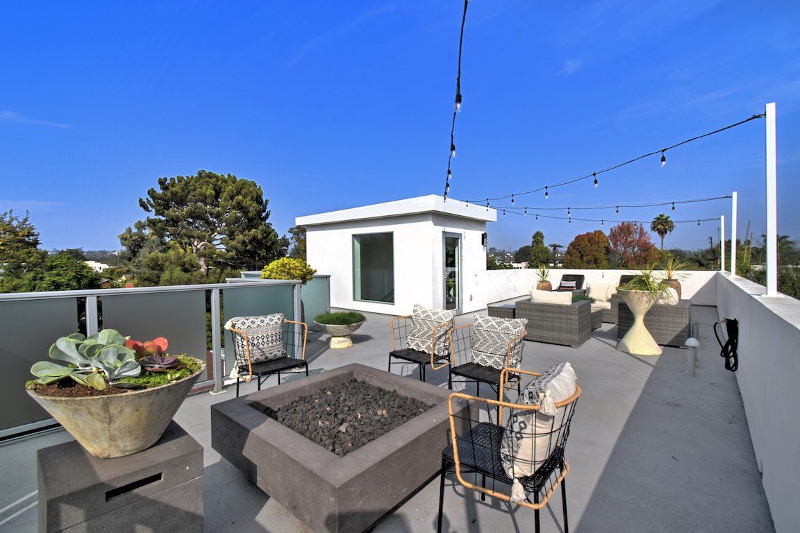 There is a fire pit on the roof of a building.