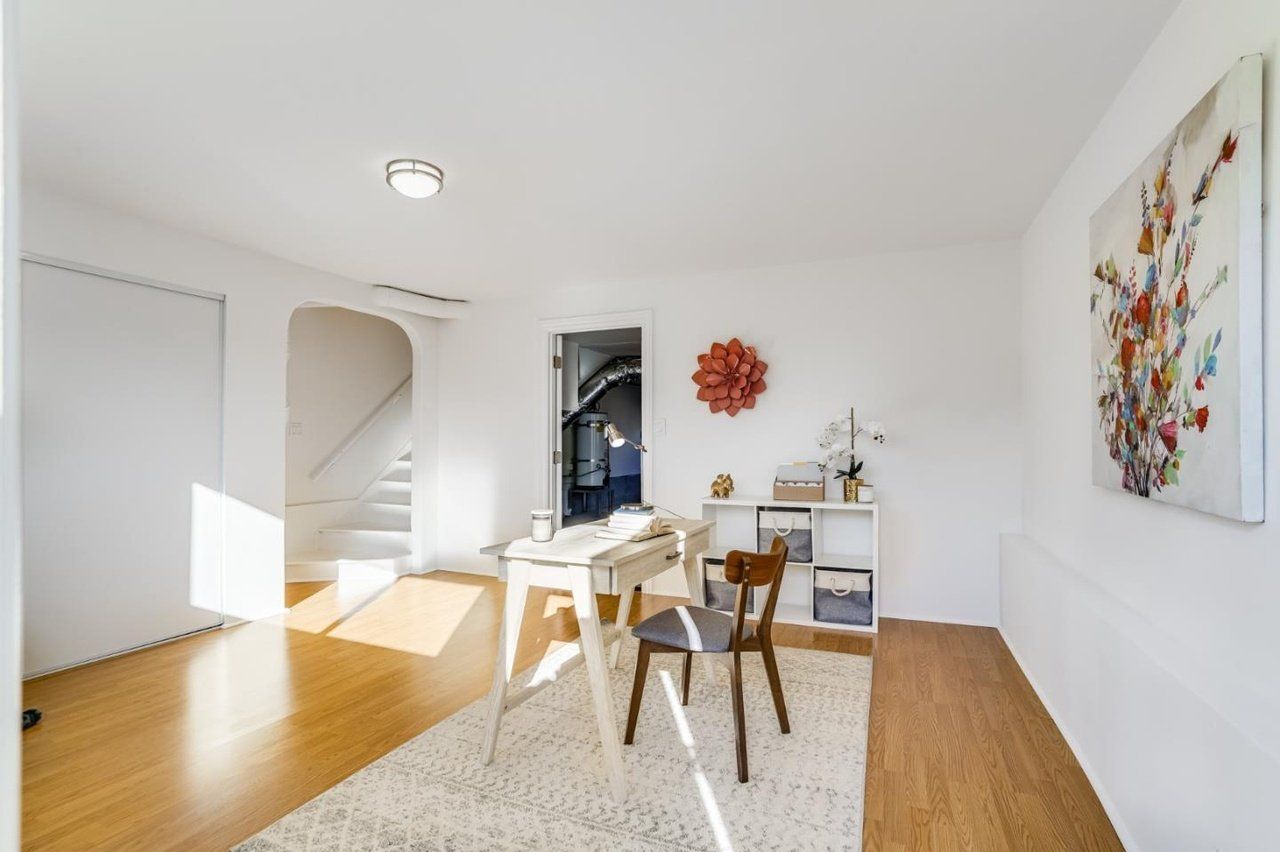 There is a desk and chair in the room.