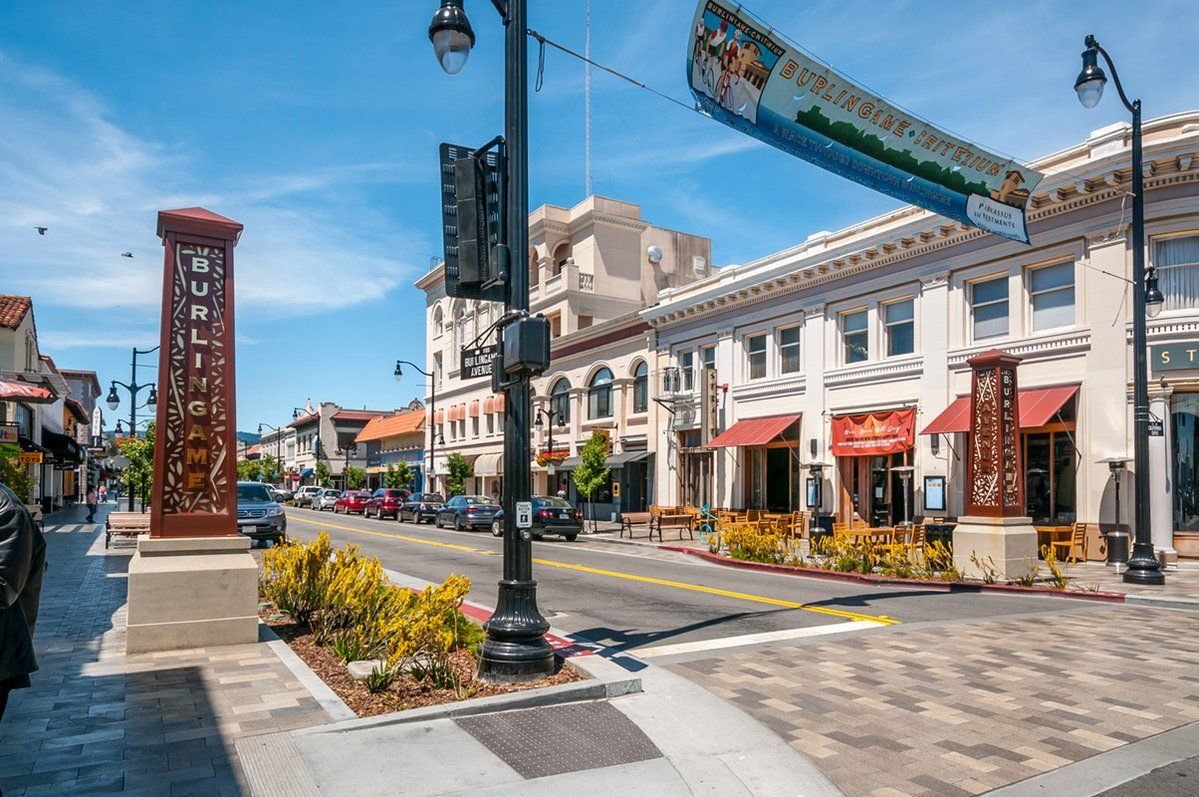 A city street with a lot of buildings and a street light.
