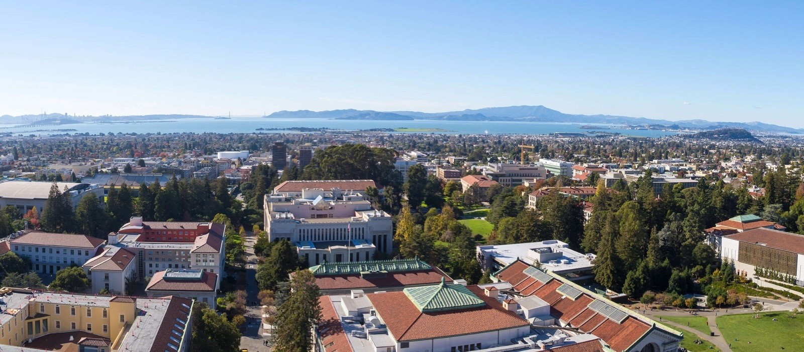 An aerial view of a city with a lot of buildings and trees.