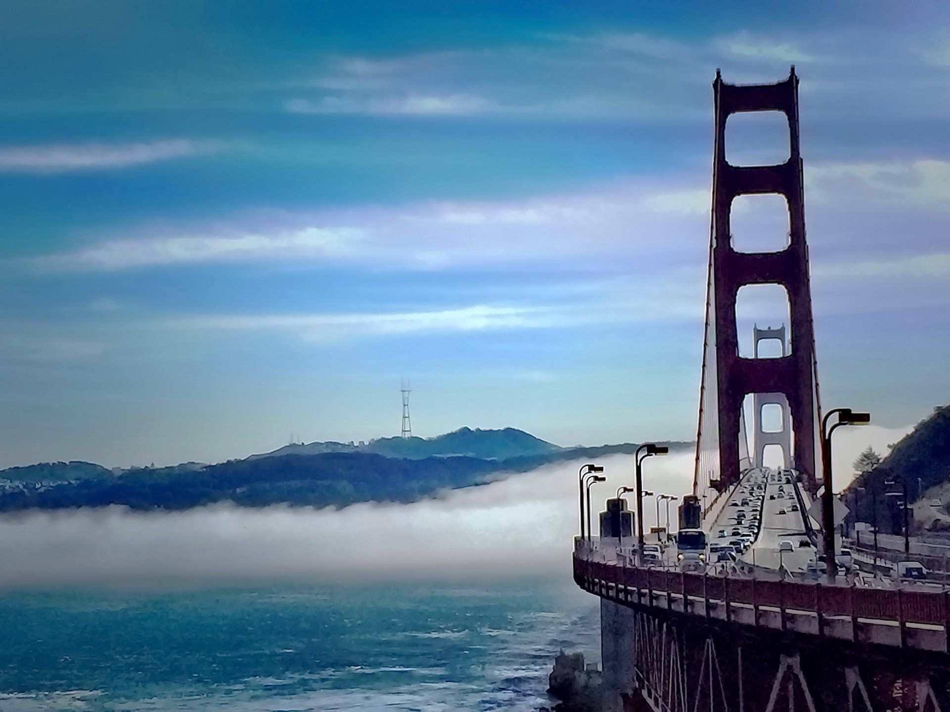 The golden gate bridge in san francisco is covered in fog