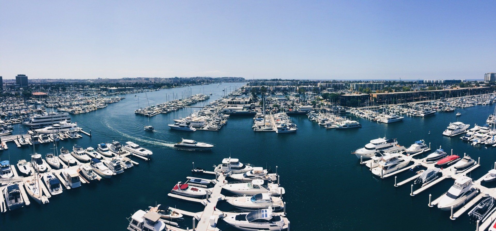 An aerial view of a marina filled with lots of boats.