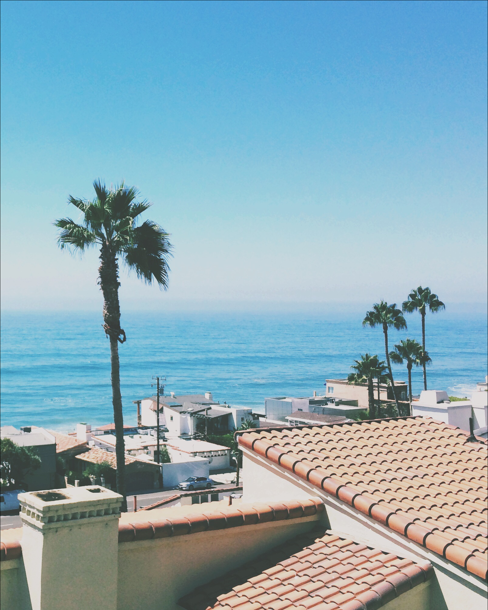 A view of the ocean from the roof of a building